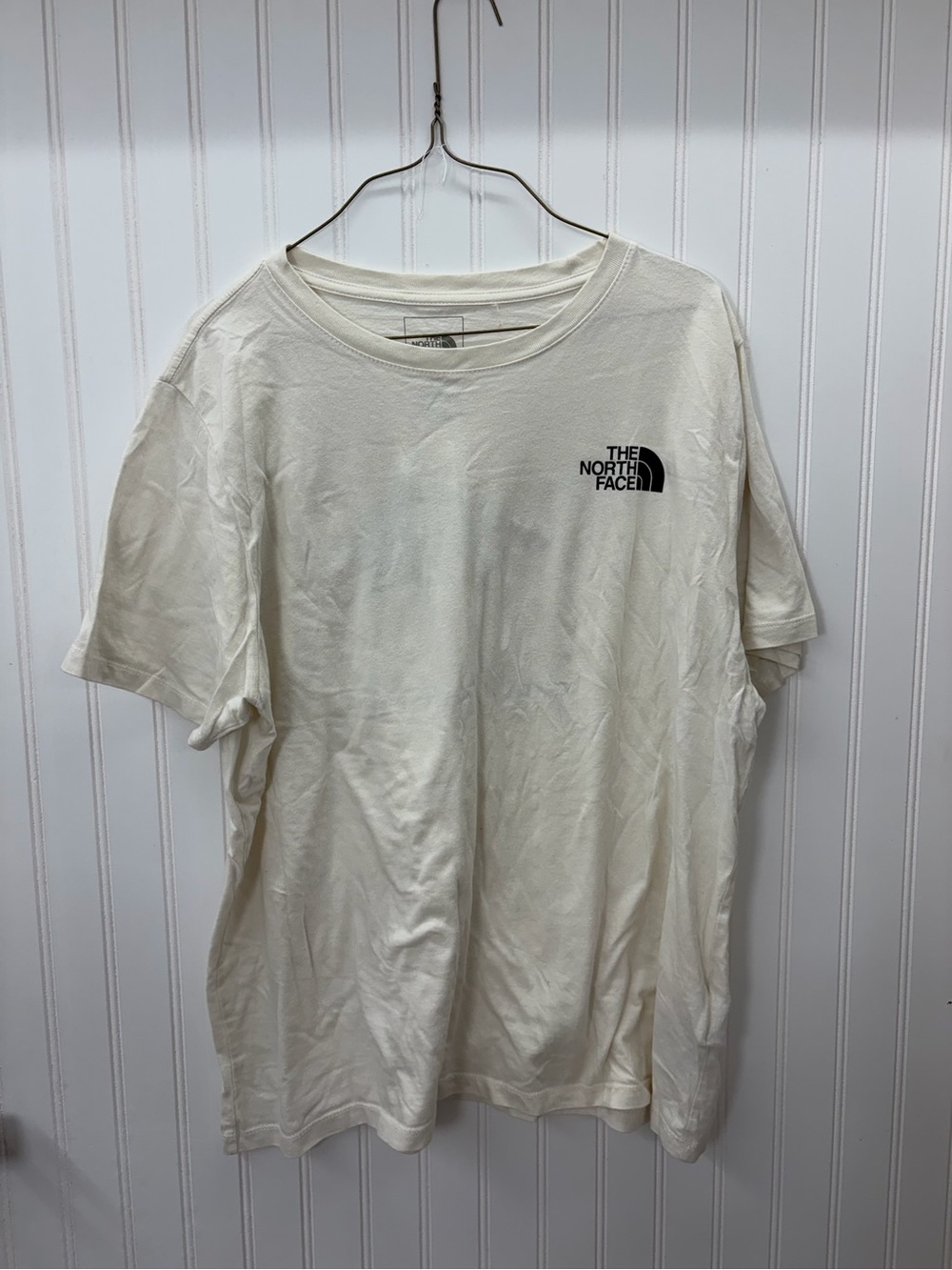 The North Face Men’s Cream Short-Sleeve Logo Tee with Black Chest Emblem